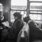 Thumbnail of http://Harold%20Feinstein%20-%20A%20passenger%20sleeps%20on%20a%20subway%20train%20with%20his%20head%20on%20the%20seat%20back,%20while%20another%20passenger%20reads%20a%20magazine%20and%20a%20third%20looks%20up%20from%20reading,%20New%20York,%201947.